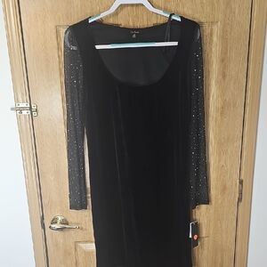 Black Dress with Sheer Sparkling Sleeves runs small